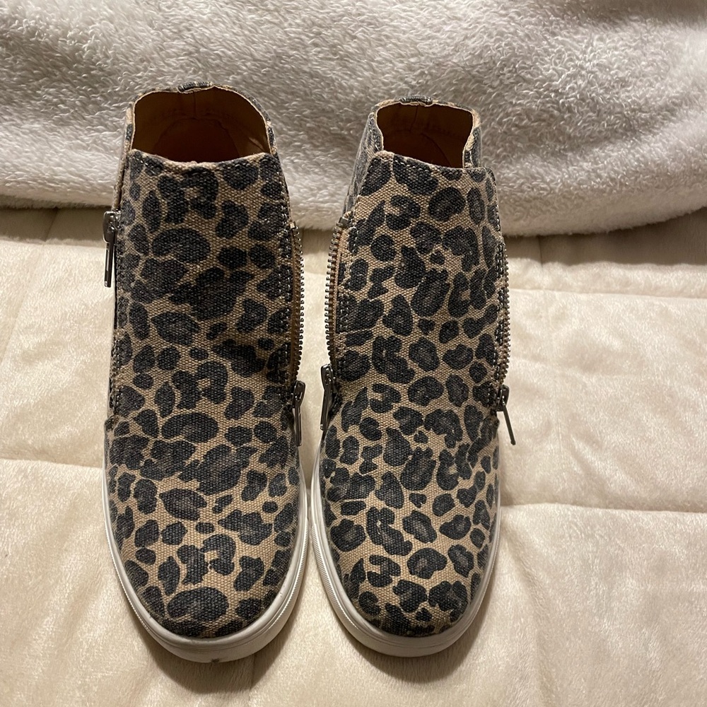 Cheetah print high top wedge sneaker.